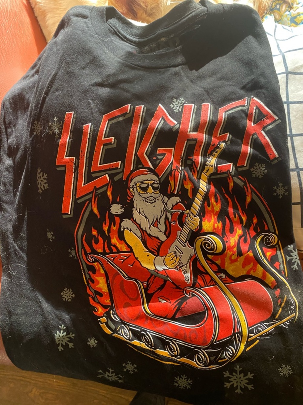 3/$15. “Sleigher” Men’s Black Graphic Tee with Santa and Guitar Design.